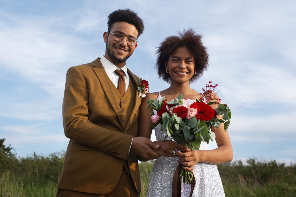 medium-shot-bride-groom-posing-outdoors